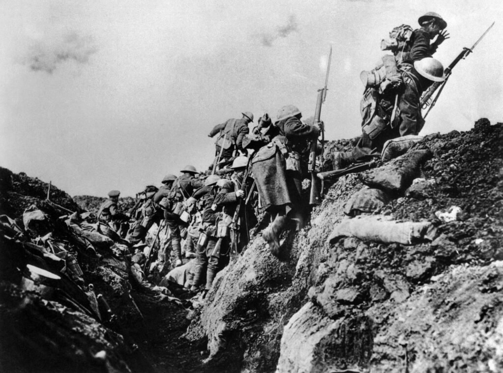 ca. 1914-1918, France --- A company of Canadian soldiers go "over the top" from a World War I trench. --- Image by © Bettmann/CORBIS